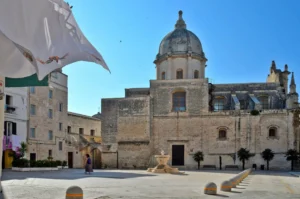 A narrow street between the houses of the village of Monopoli i
